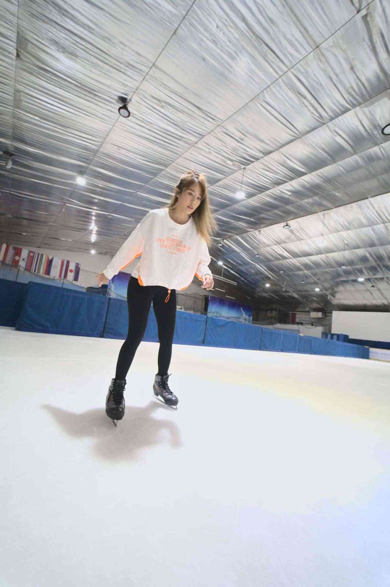 a woman walking on ice rink