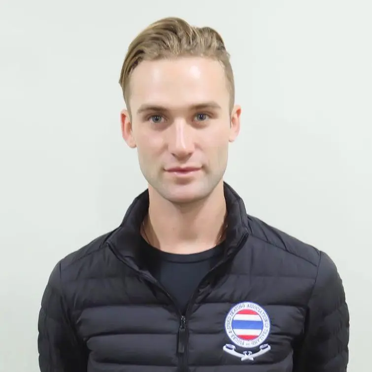 An international figure skater coach of IWIS in black jacket.